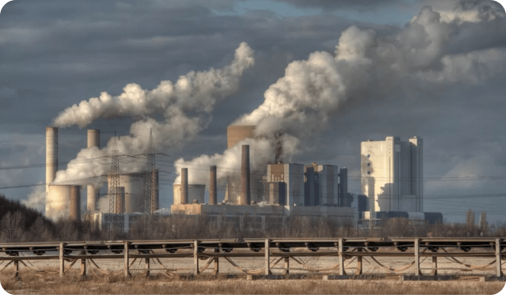 the industrial air filters realsing smoke showcasing Increased Emissions and Environmental Risks