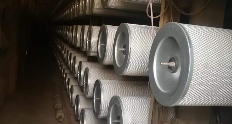 Rows of cylindrical industrial filters installed in a facility, showcasing their structure and alignment